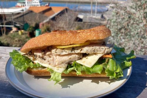 a sandwich on a plate on a table at Lemon tree hotel in Higashiura