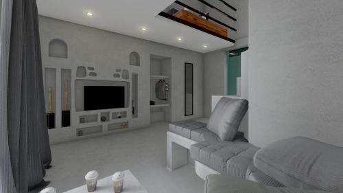 sala de estar blanca con sofá y TV en NYAST VALLEY RESORT, ARPORA en Arpora