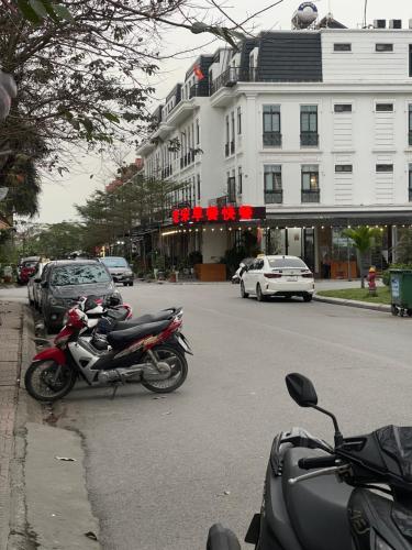 a motorcycle parked on the side of a street at Basic Guest House Hải Phòng in Hai Phong