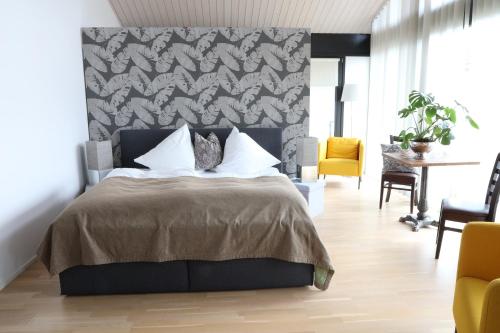 Ένα ή περισσότερα κρεβάτια σε δωμάτιο στο Residence