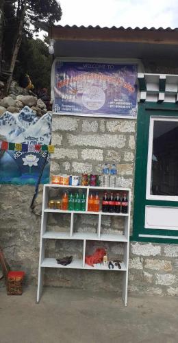 a drink stand in front of a building at White lotus inn in Pangboche