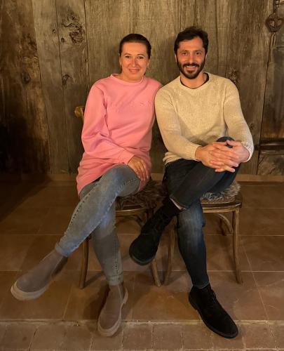 a man and a woman sitting on a chair at VILLA ANGEL in Rožňava