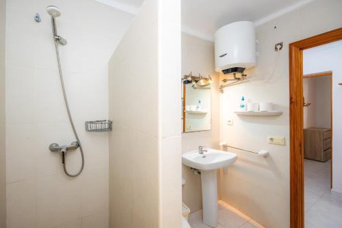 a bathroom with a sink and a shower at Apartamento mhm 5 in Cala Ratjada