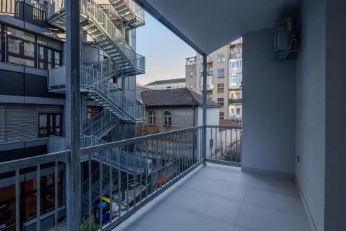 a balcony with a spiral staircase in a building at Leone Central Luxury Apartments - Happy Rentals in Zagreb