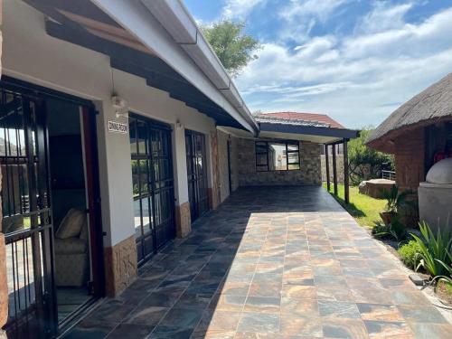 a walkway leading to the front of a house at Eagles View Kungwini in Erasmus