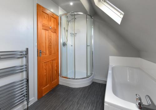 a bathroom with a shower and a sink at 243 Cae Du in Abersoch