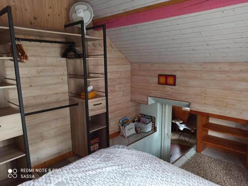 a bedroom with a bunk bed in a room at Les abris de la hulotte in Anould