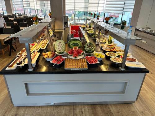 a buffet line with many different types of food at SiDE GOLDEN ROCK HOTEL&SPA in Side