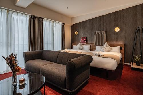 Postel nebo postele na pokoji v ubytování Apartment Hotel 11 Shinsaibashi Amemura