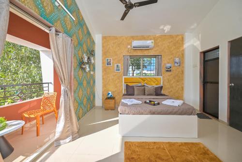 a bedroom with a bed and a balcony at ll EMPYREAN STAY ll AIRAWAT VILLA ll 2BHK ll AC ll PVT POOL ll LUXURY VILLA ll in Lonavala