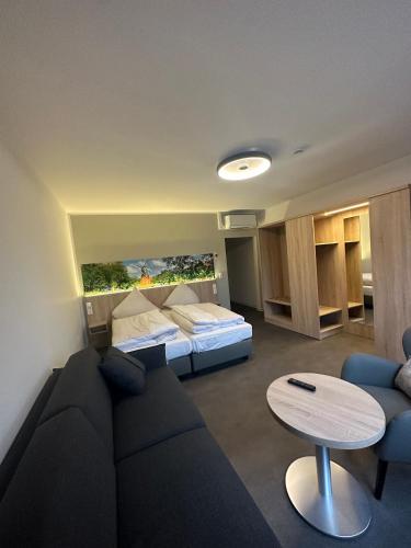 a living room with a couch and a bed at MediTerra in Papenburg