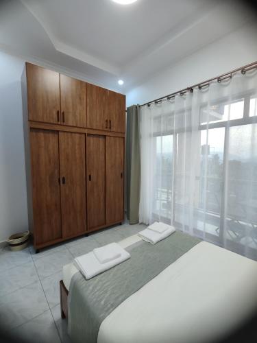 Ένα ή περισσότερα κρεβάτια σε δωμάτιο στο Wepick Homes