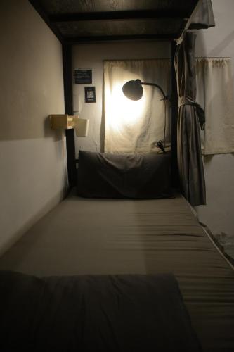 Ένα ή περισσότερα κρεβάτια σε δωμάτιο στο 綠島寧靜海自潛旅宿 TwinkleOcean Freediving Hostel