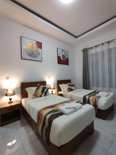 Ένα ή περισσότερα κρεβάτια σε δωμάτιο στο Wepick Homes