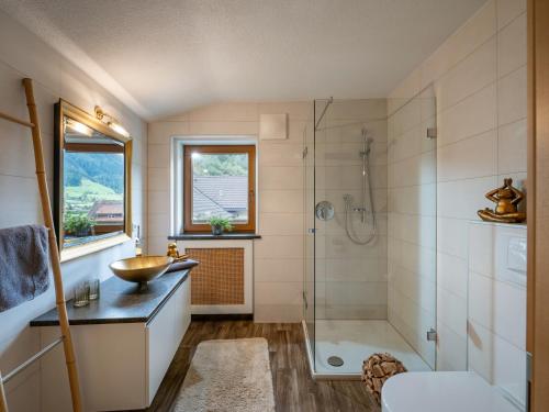 a bathroom with a sink and a shower at Appartement Andrea Hauser - Riedltischler in Zell am Ziller