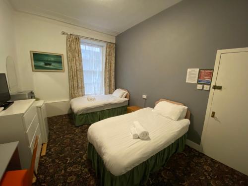 TV a/nebo společenská místnost v ubytování Aaran Central Guesthouse