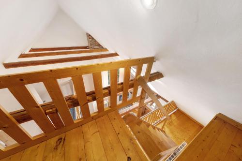 an overhead view of a wooden staircase in a house at Galerie Haus Wohnung 2 in Sehestedt