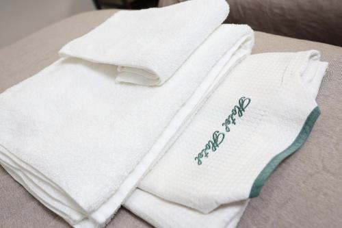 two white towels sitting on top of a table at Sapporo Oriental Hotel in Sapporo