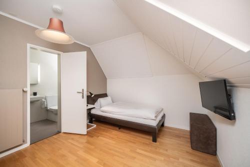 Un ou plusieurs lits dans un hébergement de l'établissement Boutique Hotel Moosegg