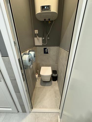 a small bathroom with a toilet at Green Hostel Katowice 24h - Free Parking in Katowice