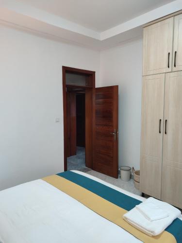 Ένα ή περισσότερα κρεβάτια σε δωμάτιο στο Wepick Homes