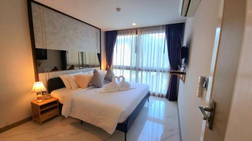 Voodi või voodid majutusasutuse B406-Pool View One Bedroom Ao Nang Beach toas
