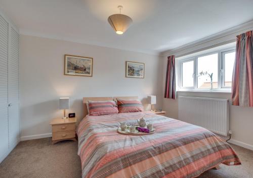 a bedroom with a bed with a tray on it at Moraine in Ravenscar