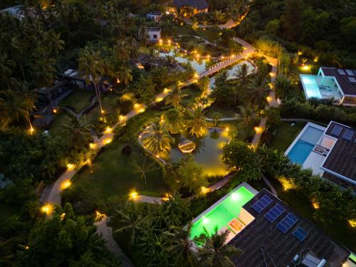an overhead view of a backyard at night with lights at Ycona Eco-Luxury Resort, Zanzibar in Dikoni