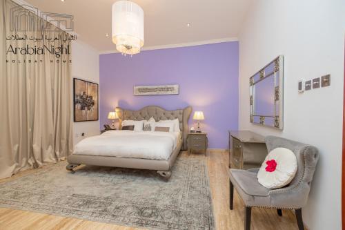 a bedroom with purple walls and a bed and a chair at Arabian Nights - Exclusive Villa With Private Pool in Al Hamra Palace in Dubai