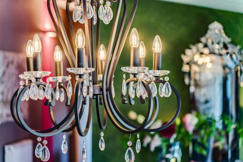 a chandelier with many crystals hanging from it at Jugendstil-Hof in Langenlonsheim