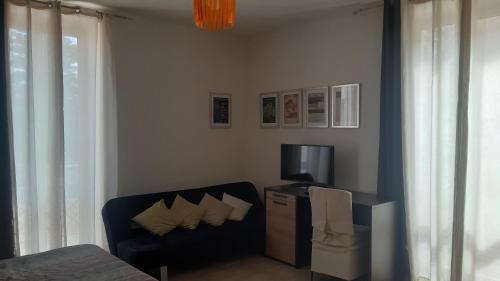 TV a/nebo společenská místnost v ubytování Casa Antioco B&B