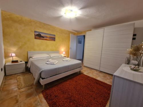 Casa al Mare STELLA MARINA tesisinde bir odada yatak veya yataklar