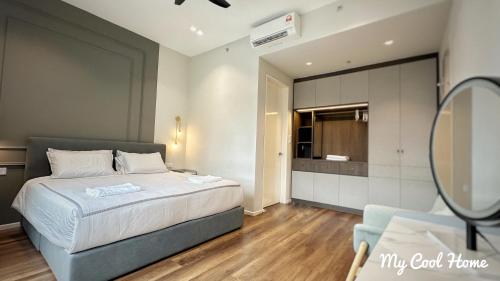 a bedroom with a bed and a mirror at Sunway Onsen Suite Theme Park View Top Floor at Lost World in Tambun