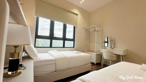 a hotel room with two beds and a window at Sunway Onsen Suite Theme Park View Top Floor at Lost World in Tambun