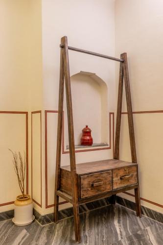 a mirror on a shelf in a room at Sum Jaipur in Jaipur
