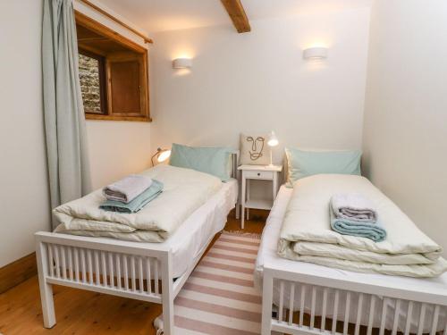 Postel nebo postele na pokoji v ubytování Chews Cottage