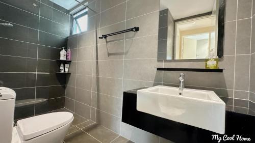 a bathroom with a sink and a toilet at Sunway Onsen Suite Theme Park View Top Floor at Lost World in Tambun