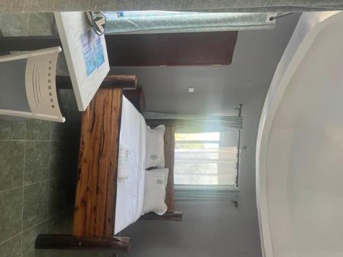 a hallway of a kitchen with a window and a sink at OLENG'OTI GARDENS in Narok
