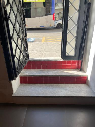an open door of a building with a view of a street at A casa di nonno Peppe in Florence