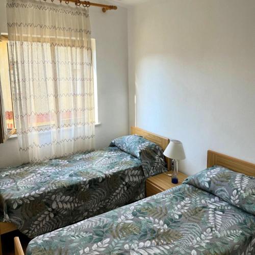 Ένα ή περισσότερα κρεβάτια σε δωμάτιο στο MAREMEU TROPEA