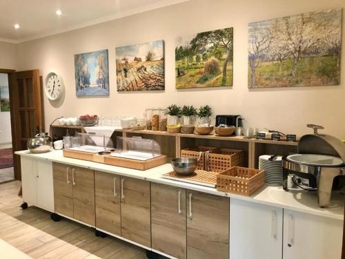 a kitchen with a counter with many items on it at Landhaus Fillerberg in Wildeshausen