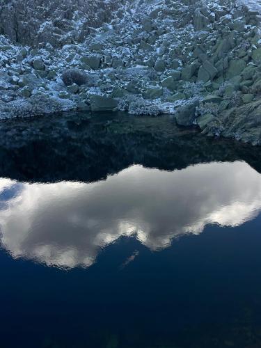 a reflection of the sky in a body of water at Casa dos Toros in Cortes do Meio