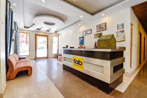 a lobby with a reception desk in a building at FabHotel Manali Heaven in Manāli