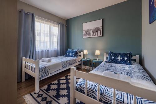 Llit o llits en una habitació de Moringa Gardens 2D