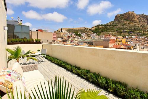 a balcony with a view of a city and a mountain at Holihome Rambla 24 in Alicante