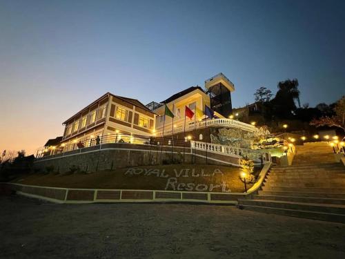 a large building with stairs and lights in front of it at ROYAL VILLA RESORT in Kathmandu