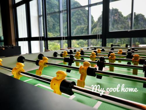 a row of cue balls on a pool table at Sunway Onsen Suite Theme Park View Top Floor at Lost World in Tambun