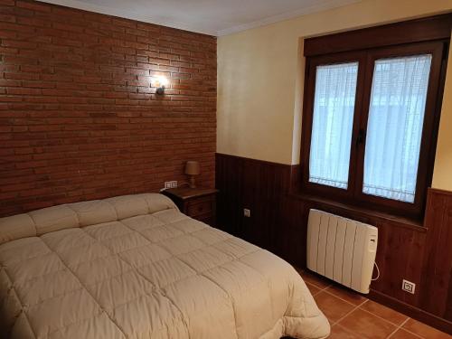 מיטה או מיטות בחדר ב-VuT Casa Fabe12