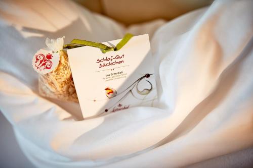 a bag of food sitting on a white sheet at Donauhotel Lettnerhof in Au an der Donau