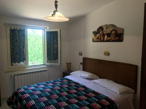 Кровать или кровати в номере Residence Amici del Sorriso